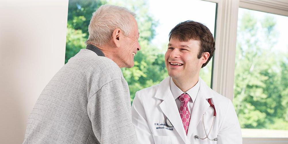 Doctor with patient - smiling